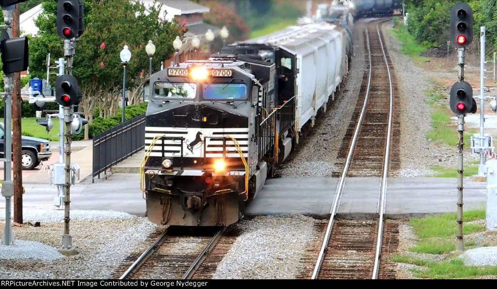 NS 9700 / C40-9W leading a mixed freightby the AMTRAK Station